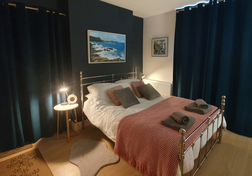 The bedroom with the curtains closed